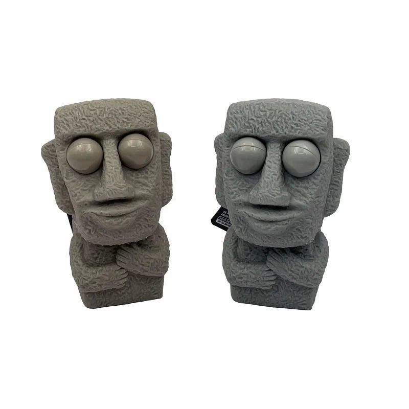 Stone man releases stress toy slowly rebounds soft Moai statue squeeze eyes interested expression relaxes stress children's gift